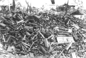 Wreckage of buildings on Kwajalein after intense fighting and artillery. Photo taken by George Smith.